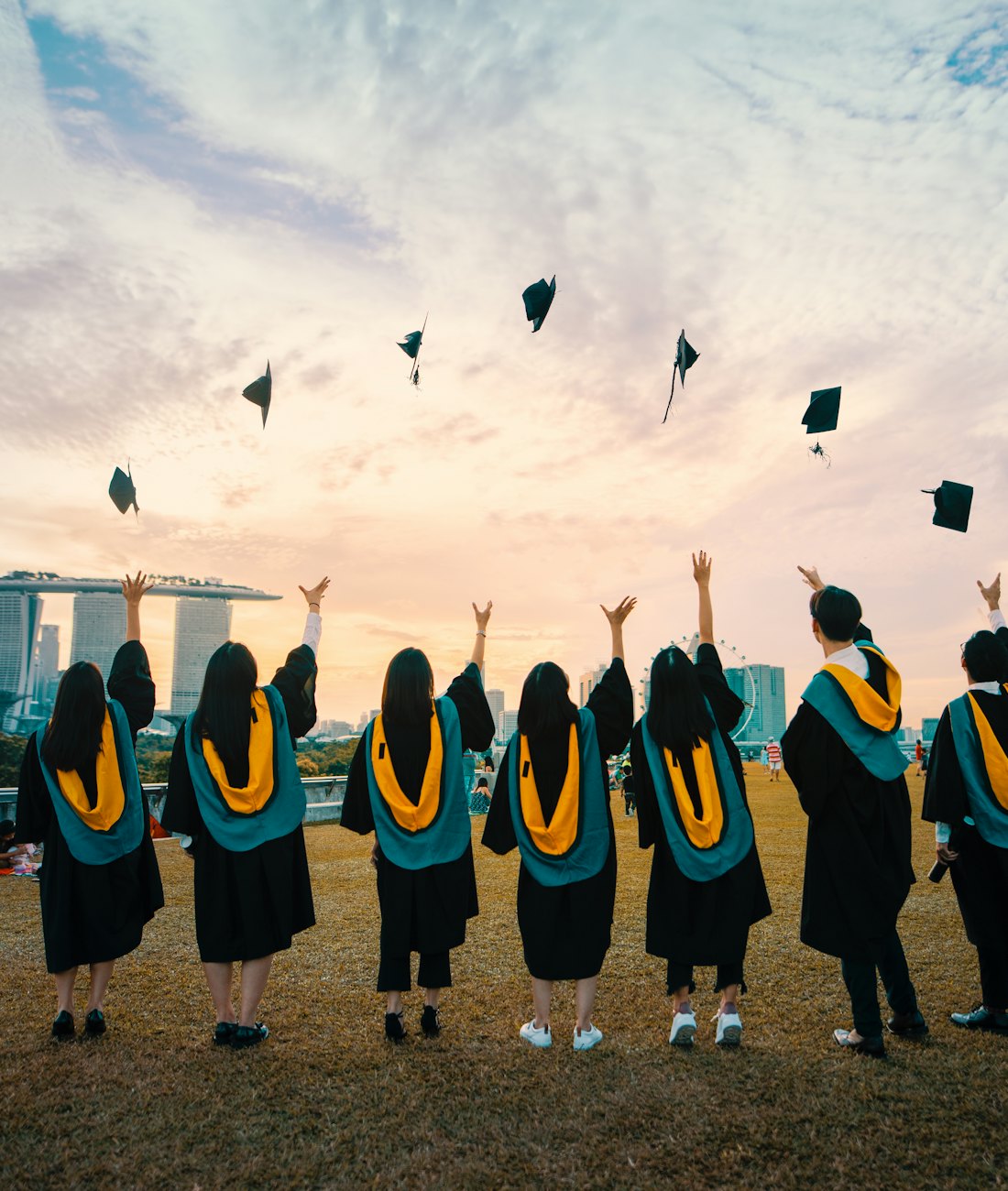 Graduates throwing their caps in the air